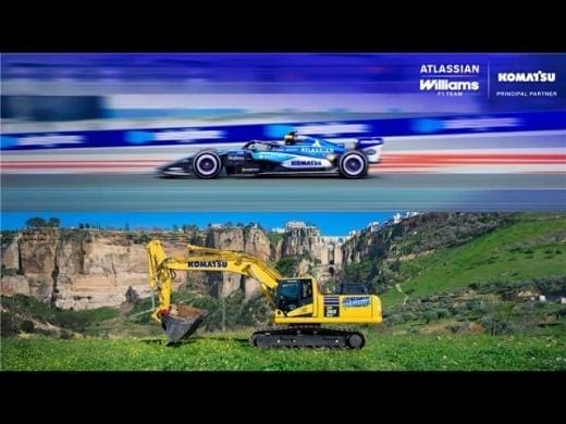 Komatsu reklamında Williams F1 aracı, pistte hızla ilerliyor.