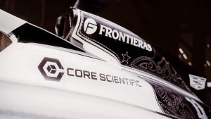 Cadillac F1 kovboy livery Frontieras ve Core Scientific sponsor detayı — nakış işlemeli siyah panel, ABD GP Austin 2026